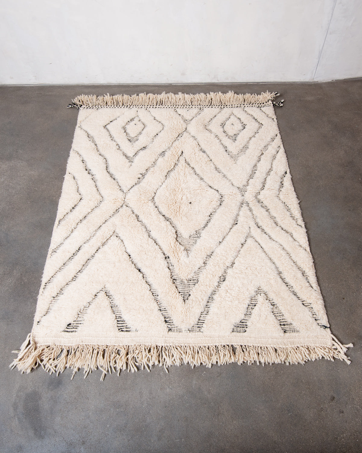 Modern, designer, handcrafted Berber rug from Morocco. Beniourain carpet with beautiful colours and patterns and fluffy wool texture.